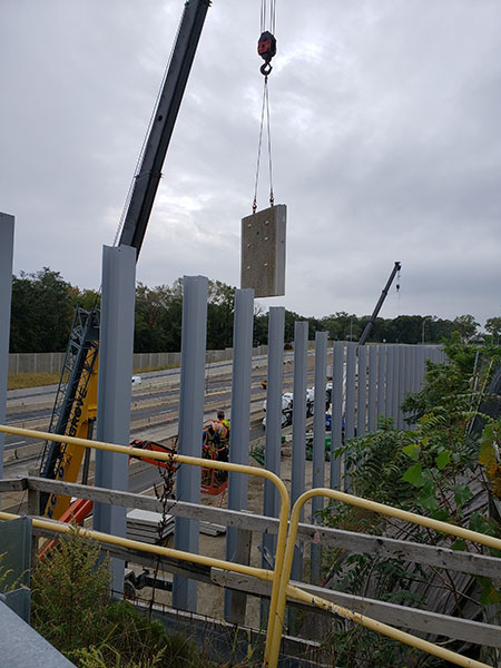 Installation of noise wall panels on I-95